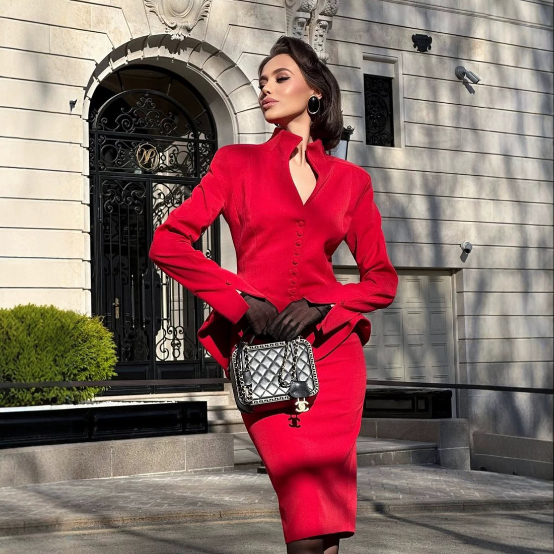 Conjunto de falda y americana con bajo de volantes